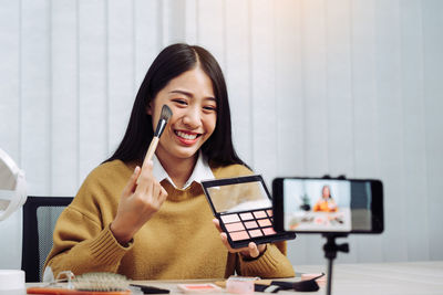 Young woman using laptop at home