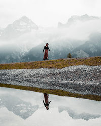 Full length of person on snowcapped mountains during winter