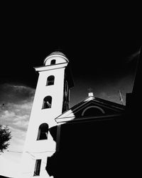 Low angle view of bell tower against sky