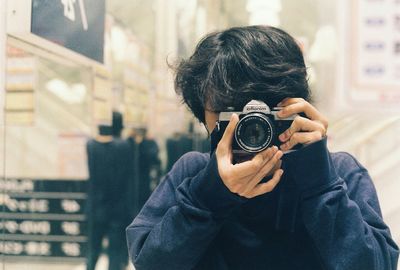 Man photographing through camera