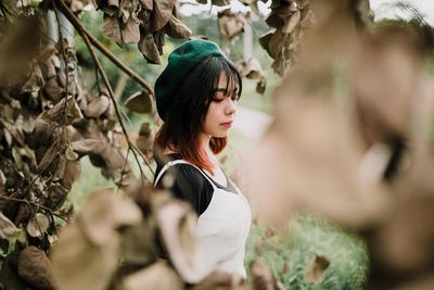 Young woman looking away outdoors