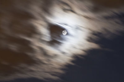 Low angle view of water drop against sky