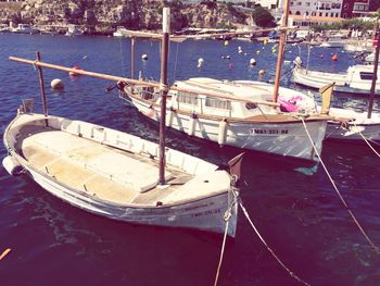 Boats moored at harbor