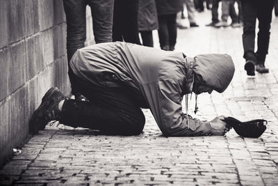 People sleeping on sidewalk