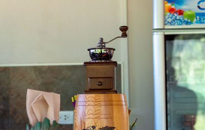 Close-up of electric lamp on table at home