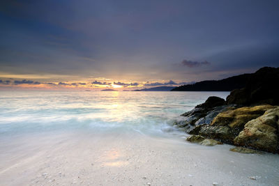 Scenic view of sea against sky during sunset