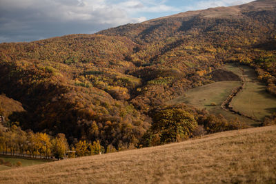 Scenic view of autumn landscape of mountains against the sky