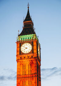 Low angle view of clock tower against sky