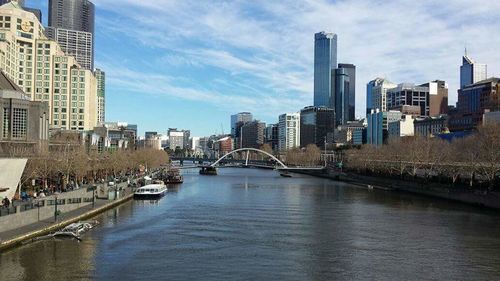 View of bridge over river in city