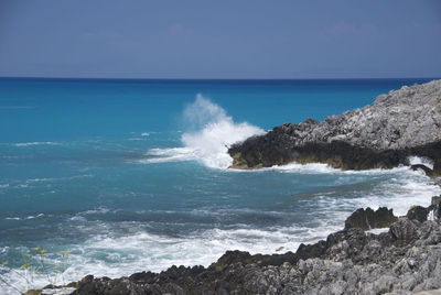 Scenic view of sea against clear blue sky