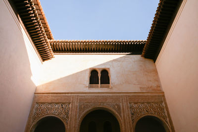 Low angle view of historic building against clear sky