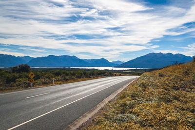 Scenic view of mountains against cloudy sky