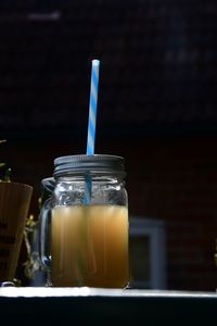 Close-up of drink in glass jar on table 