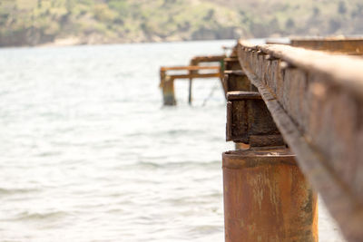 Cropped bridge over calm lake