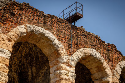 Low angle view of old ruins against clear sky