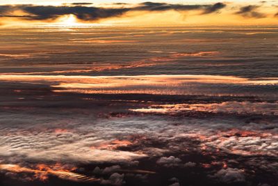 Low angle view of dramatic sky during sunset