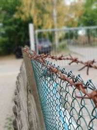 Close-up of metal fence outdoors