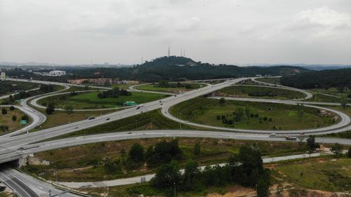 Aerial view of a intersection with a clover-leaf interchange