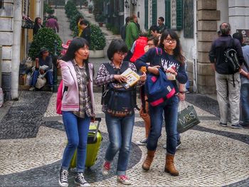 People standing on street in city