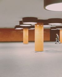 Full length of man on table in illuminated building