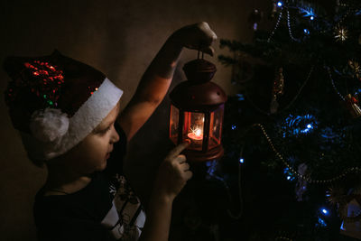 Illuminated christmas tree at night