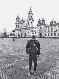 Full length of man standing outside building