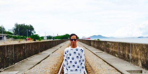 Young woman standing in water