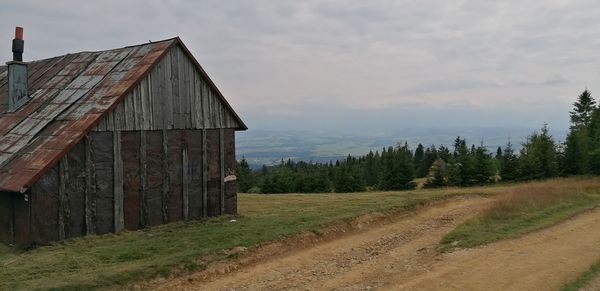 Panoramic shot of trees on field against sky
