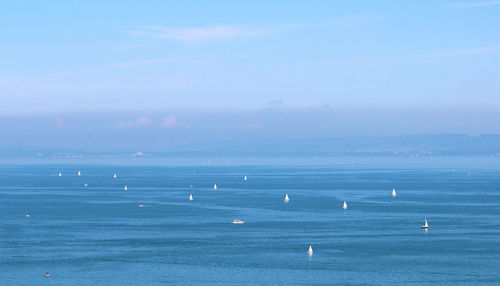 Scenic view of sea against blue sky