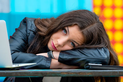 Portrait of young woman at cafe