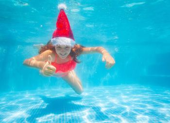 Woman swimming in pool