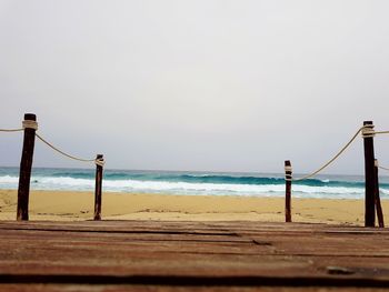 Scenic view of beach against clear sky