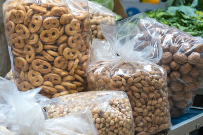 Typical apulian taralli, hazelnuts, almonds and walnuts in transparent plastic bags