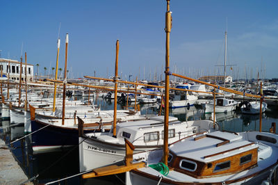 Boats moored at harbor