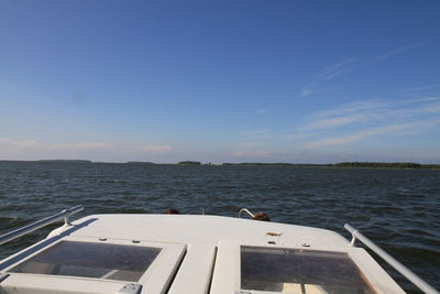 Scenic view of sea against blue sky