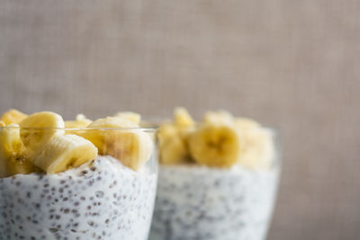 Close-up of chopped fruit on table against white background