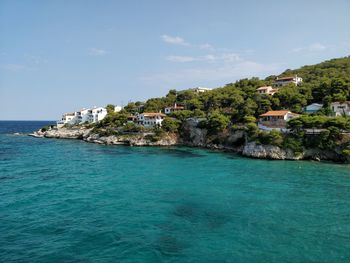 Scenic view of sea against blue sky