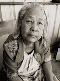 Portrait of a girl sitting outdoors