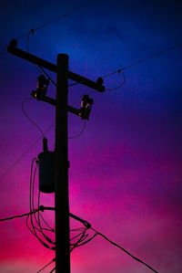Low angle view of electricity pylon