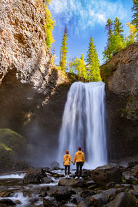 View of waterfall against rock formation