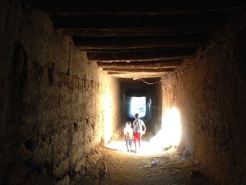 People walking in tunnel