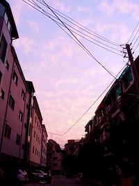 Low angle view of buildings against sky during sunset