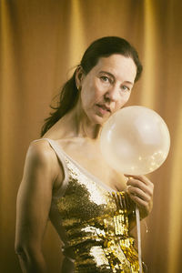 Woman behind an illuminated balloon ii