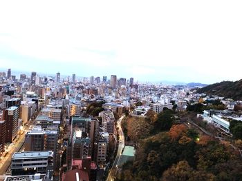 High angle view of buildings in city against sky