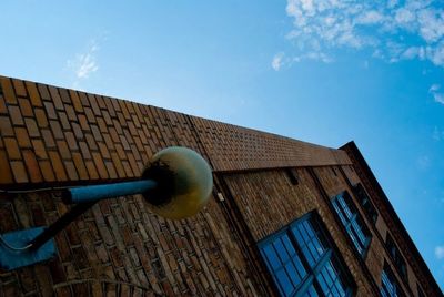 Low angle view of built structure against blue sky