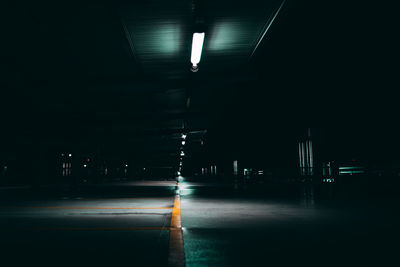 Illuminated empty parking lot at night