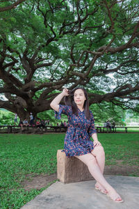 Portrait of smiling young woman in park