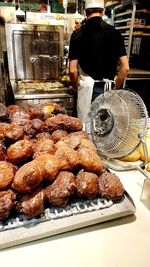 Rear view of man preparing food