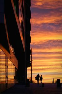 Silhouette of built structure at sunset