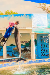 Close-up of clothes hanging on swimming pool